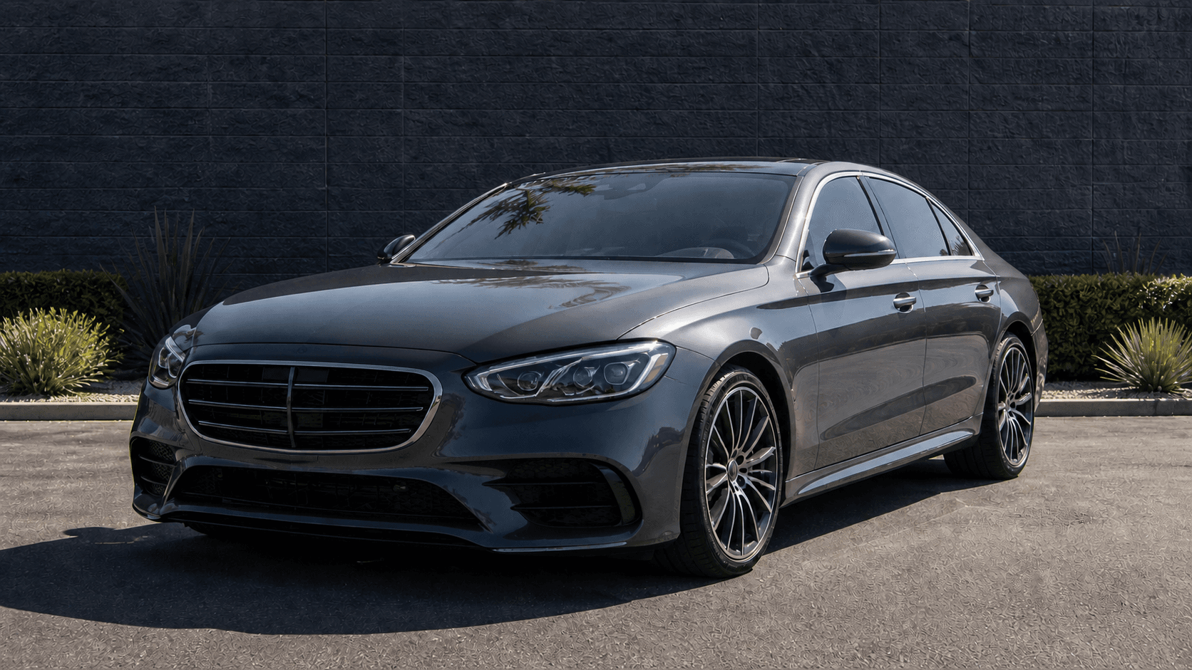 Representative dark gray sedan after front-end collision repair